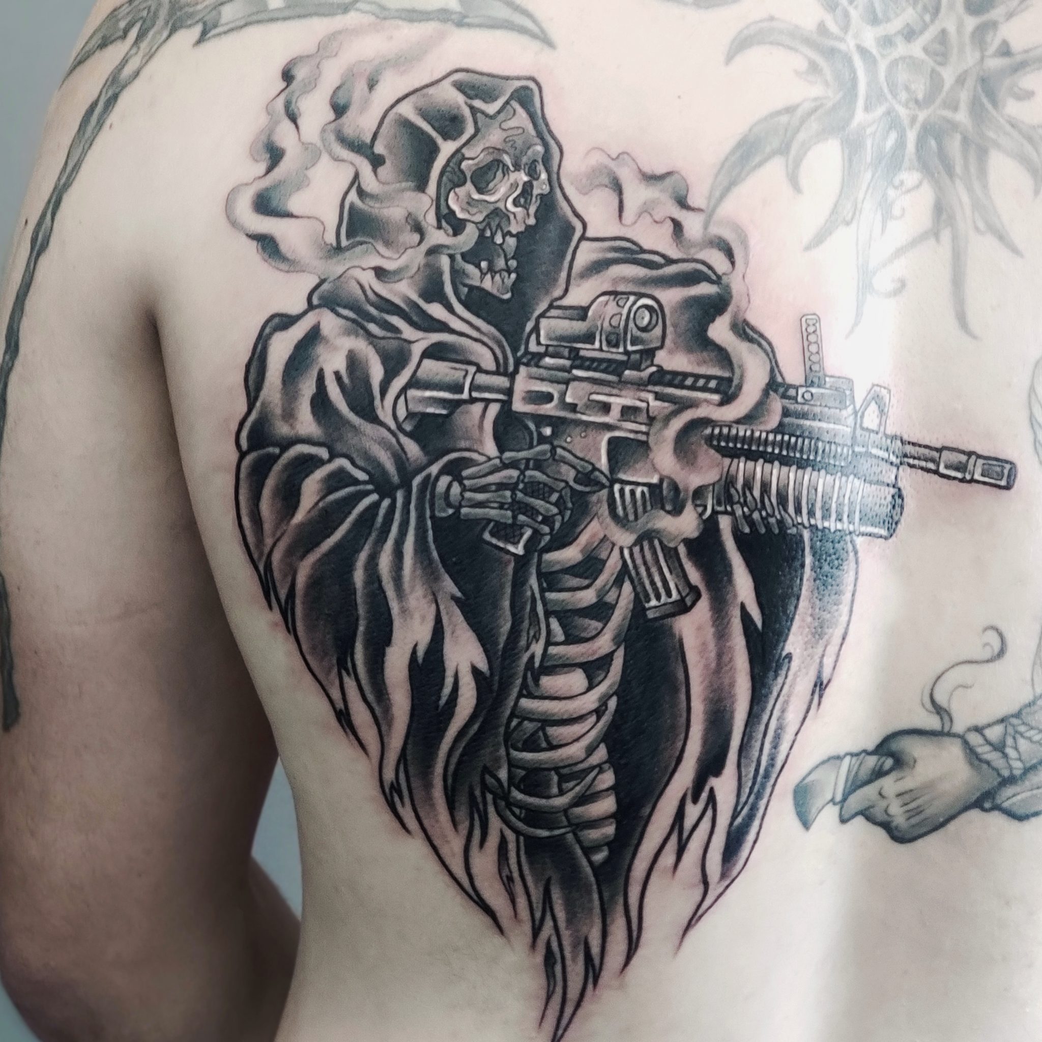 grim reaper with gun tattoos